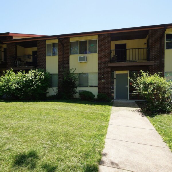 455000 | 7499 Hazelcrest Dr, Hazelwood, MO 63042Hazelcrest condos exterior of one of the buildings with a sidewalk to the units and yard area