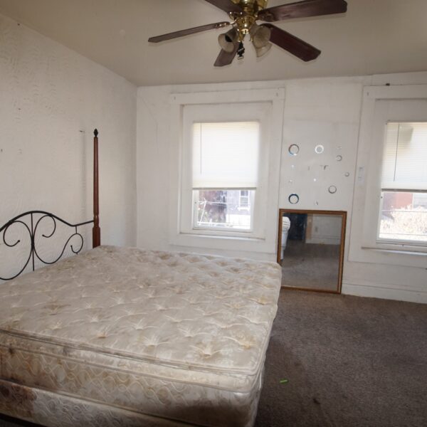 125000 | 3734 Wisconsin Ave, St Louis, Missouri 631183734 Wisconsin bedroom with two windows and mirror on the far wall