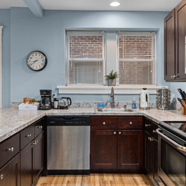 875000 | 4526-4528 Cleveland Ave, St Louis, Missouri 631104526 Cleveland kitchen  with dark cabinetry, stainless steel appliances, and sky blue walls