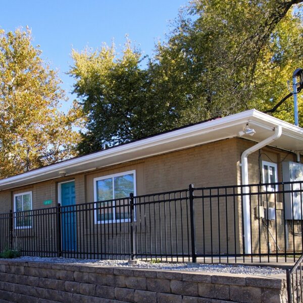 10004 Balboa exterior front with metal fencing and sidewalks around the building