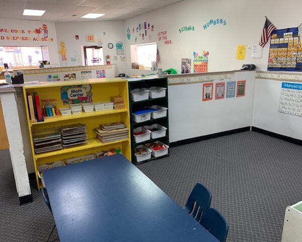 149000 | 5500 Virginia Ave., St. Louis, MO 631115500 Virginia the math center with a blue table, storage shelves, and a look at the building entrance