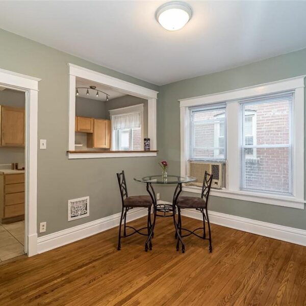 519000 | 2009 Maury Ave., St. Louis, MO 631102009 Maury dining room showing the doorway, look through into the kitchen, and large windows