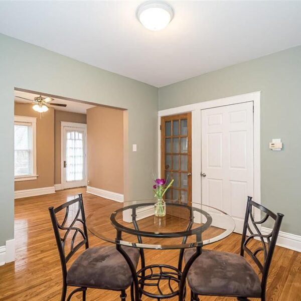 519000 | 2009 Maury Ave., St. Louis, MO 631102009 Maury dining room showing two doors on the far wall and the opening into the living room on the left