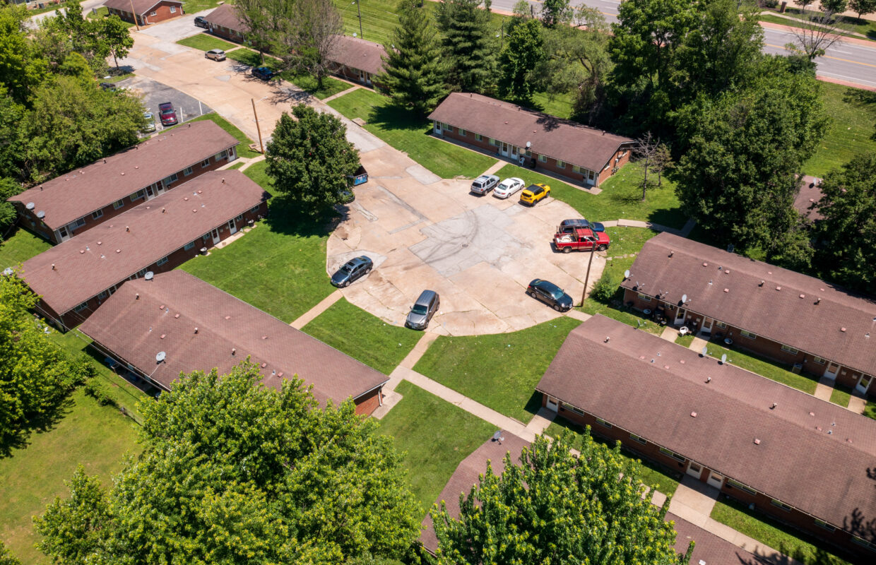 Marvin Gardens Apartments drone photo of the buildings in the circle drive and the parking area