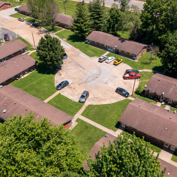 Marvin Gardens Apartments drone photo of the buildings in the circle drive and the parking area