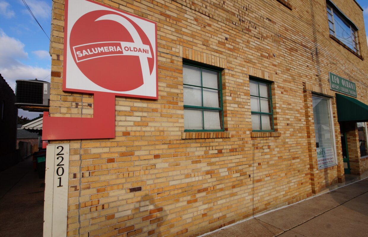 2201 Edwards Building Exterior with red and green business signage