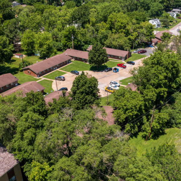 3200000 | 1-13 Marvin Gardens, St. Louis, MO 63114Marvin Gardens Apartments drone photo of the entire complex surrounded by greenery and trees