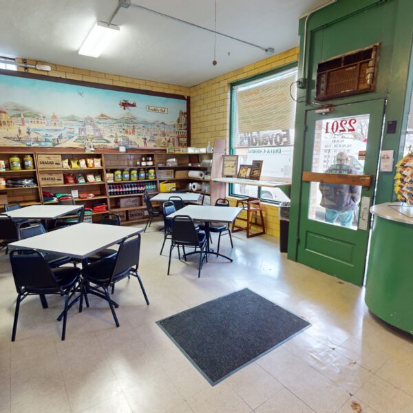 1450000 | 2201 Edwards St., St. Louis, MO 631102201 Edwards Deli Space Dining Area with four tables and Front Entryway door