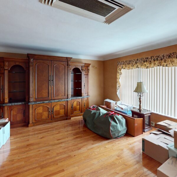 1450000 | 2201 Edwards St., St. Louis, MO 63110Residence Living Room with windows on the right and various furniture along the walls