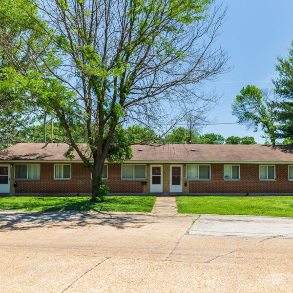 3200000 | 1-13 Marvin Gardens, St. Louis, MO 63114Marvin Gardens Apartments building exterior with a tree in front to the left