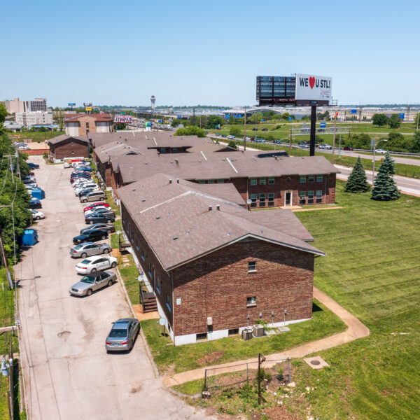 4000000 | 9921 Sloane Sq., Woodson Terrace, MO 63134Timber Place Apartments drone photo showing multiple buildings and one of the parking areas