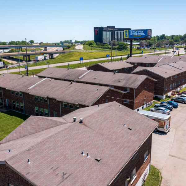 4000000 | 9921 Sloane Sq., Woodson Terrace, MO 63134Timber Place Apartments drone photo showing multiple buildings and the parking area