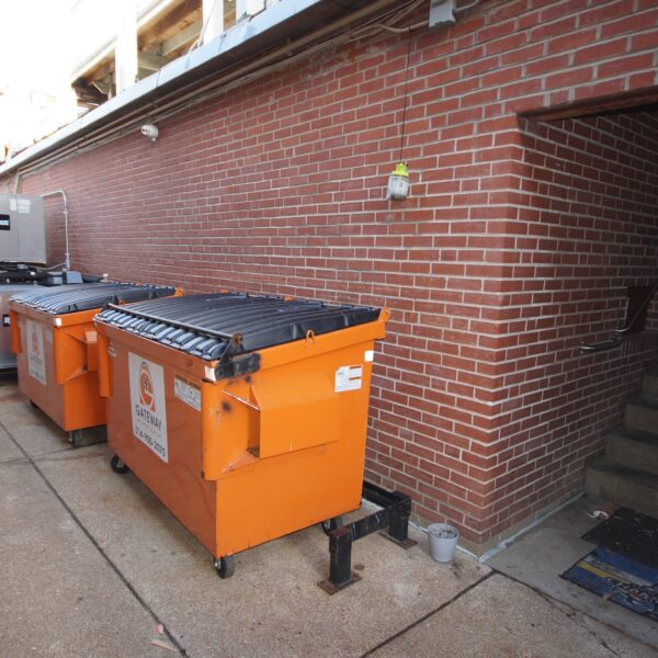 1450000 | 2201 Edwards St., St. Louis, MO 631102201 Edwards Building Alley with orange dumpsters lining the brick wall.