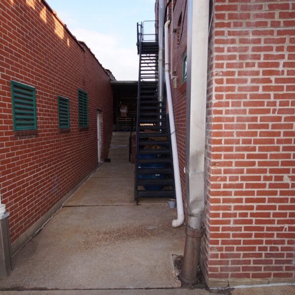 1450000 | 2201 Edwards St., St. Louis, MO 631102201 Edwards Building Alley between two sections of building with a black stairway to the roof