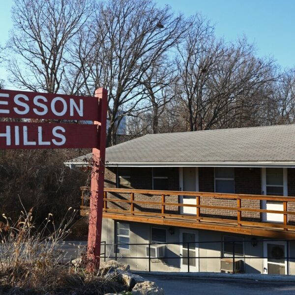 Tesson Hills Apartments exterior with apartment signage