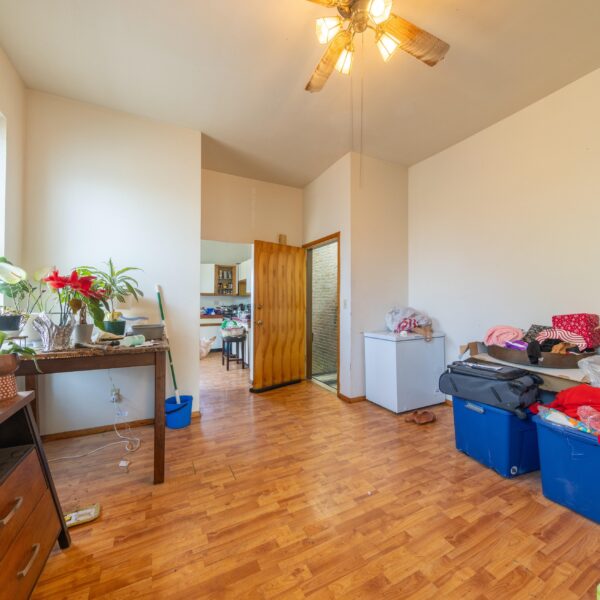 196000 | 3741 Salena St., St. Louis, MO 631183741 Salena open living area with various storage boxes on the right and furniture on the left lining the walls