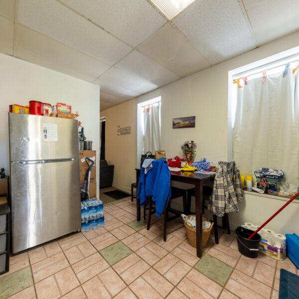 196000 | 3741 Salena St., St. Louis, MO 631183741 Salena open kitchen area with a stainless steel fridge on the left and hallway on the far side of the room