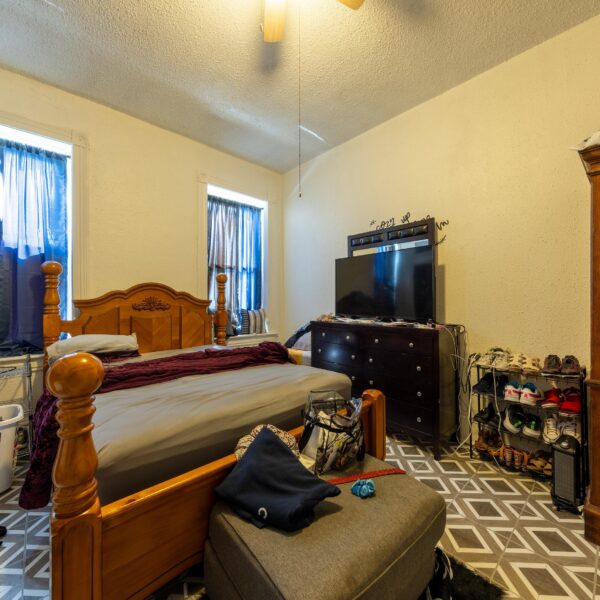 196000 | 3741 Salena St., St. Louis, MO 631183741 Salena bedroom showing a large bed with windows on both sides and several dressers lining the right wall