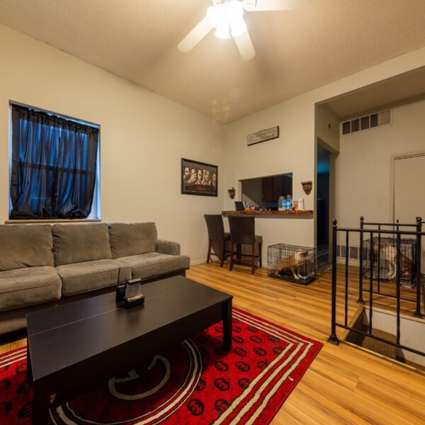 196000 | 3741 Salena St., St. Louis, MO 631183741 Salena living room area as shown from the unit entry with a grey couch on the left and stairs on the right