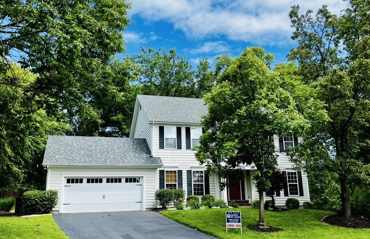 1034 Huthmaker front exterior with driveway and two car garage on the left