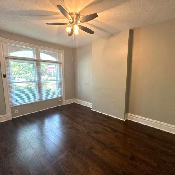 599000 | 2821-23 Henrietta Place, St. Louis, MO 631042821 Henrietta lower unit living room with large window on the far wall