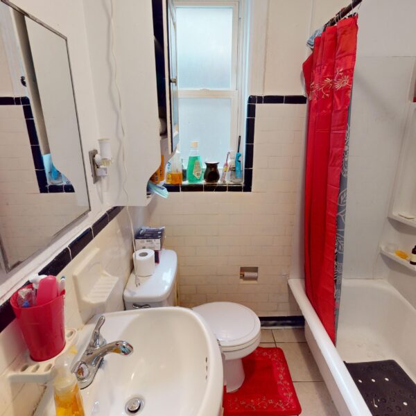 349000 | 4157 Potomac Street, St. Louis, MO 631164157 Potomac lower unit bathroom with red shower curtain