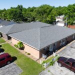 2225 North 4th exterior close up drone shot with asphalt parking lining the buildings