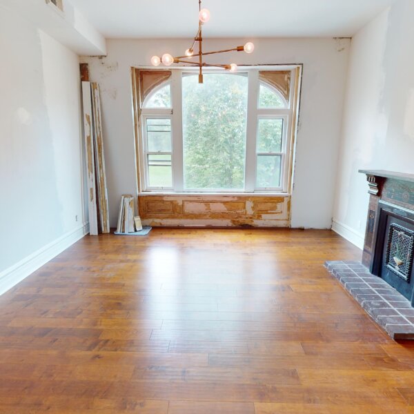 130000 | 2210A Wyoming St., St. Louis, MO 631182210A Wyoming living room area with a very large window on the far wall and a fireplace to the right