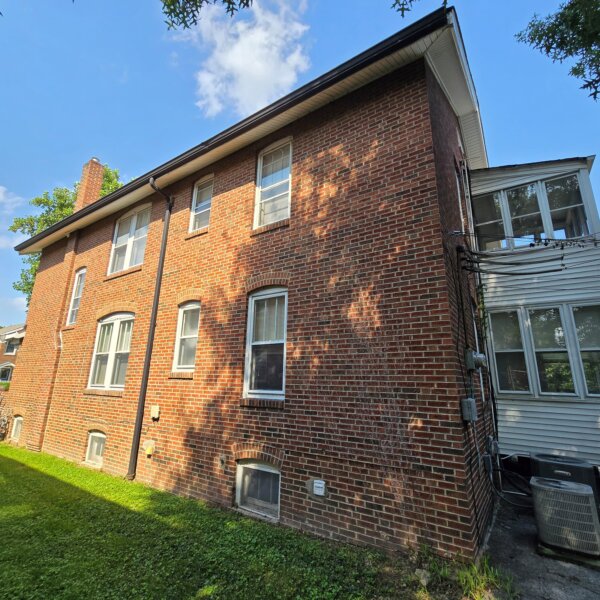 299000 | 7118 Amherst Ave., University City, MO 631307118 Amherst side exterior with the enclosed porches on the right