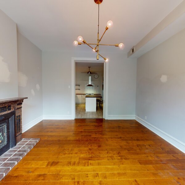 130000 | 2210A Wyoming St., St. Louis, MO 631182210A Wyoming living room area with the kitchen seen through the doorway on the far wall and a fireplace to the left