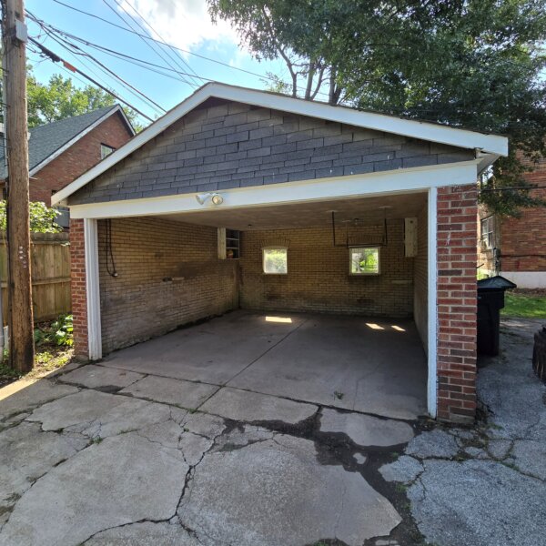 299000 | 7118 Amherst Ave., University City, MO 631307118 Amherst garage exterior with the car door open showing both the exterior and the interior