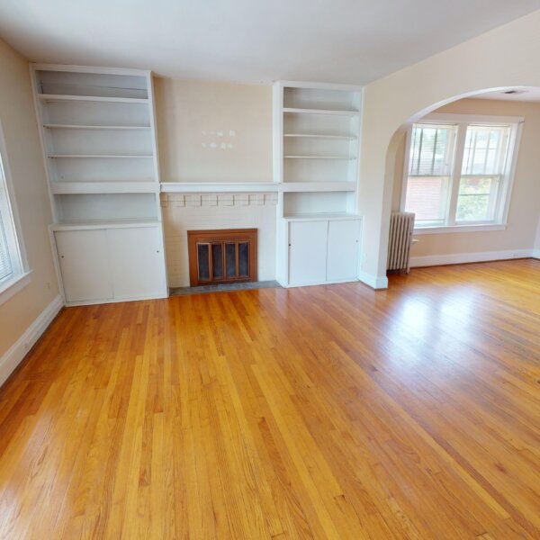 299000 | 7118 Amherst Ave., University City, MO 631307118 Amherst living room area showing the fireplace, built in bookshelves, and the entryway to the formal dining room