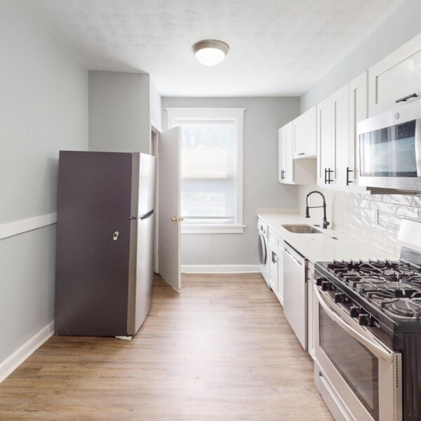 659000 | 2900-2906 Pestalozzi St., St. Louis, MO 631182900 Pestalozzi kitchen with stainless steel appliances and a door on the left