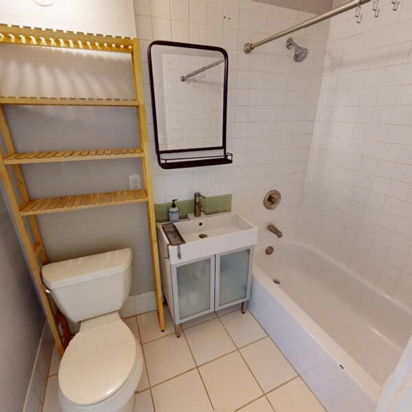 130000 | 2210A Wyoming St., St. Louis, MO 631182210A Wyoming updated bathroom with various shelving areas and tiled areas