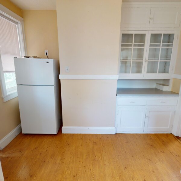 299000 | 7118 Amherst Ave., University City, MO 631307118 Amherst kitchen showing the location of the fridge, storage area, and the door to the enclosed porch/sunroom