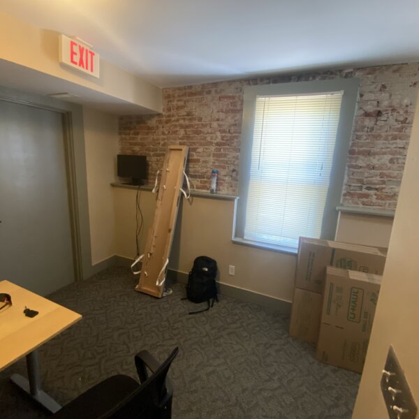 250000 | 901 1st Capitol Dr, St Charles, MO 63301901 1st Capitol office space featuring a partial brick wall with some shelving