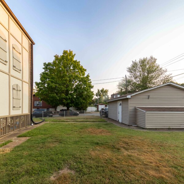 265000 | 5923 South Kingshighway Blvd, St Louis, Missouri 631095923 S Kingshighway view of the back of the garage, yard, and the exterior of the building