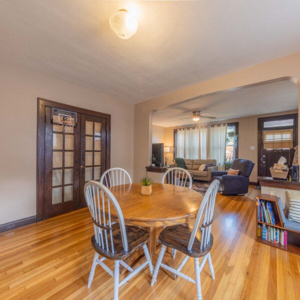 265000 | 5923 South Kingshighway Blvd, St Louis, Missouri 631095923 S Kingshighway dining room area with French doors on the left and living room past the dining set