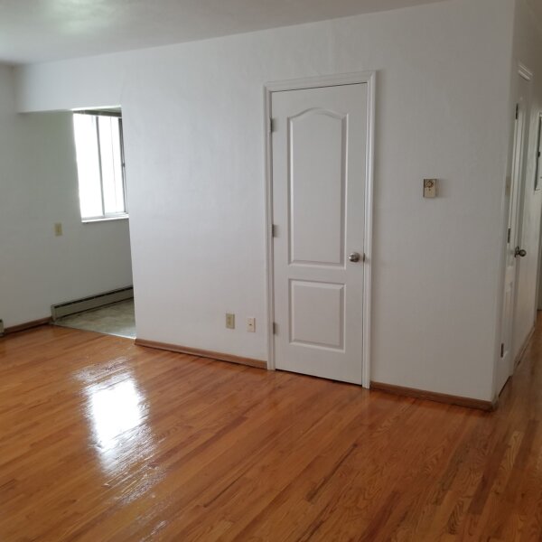 1650000 | 3537-3541 Morganford Road, St. Louis, Missouri 631163537-3541 Morgan Ford living room with white walls, white doors, and hardwood floors