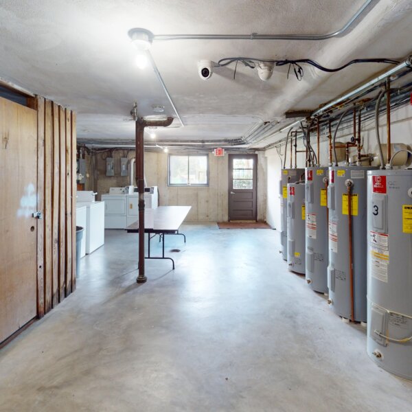 1650000 | 3537-3541 Morganford Road, St. Louis, Missouri 631163537-3541 Morgan Ford clean basement with water heater on the right and storage units on the left