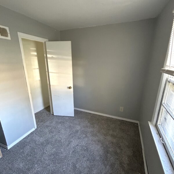 69000 | 2024 Jannette Dr, St. Louis, MO 631362024 Jannette small bedroom with gray walls and new carpeting